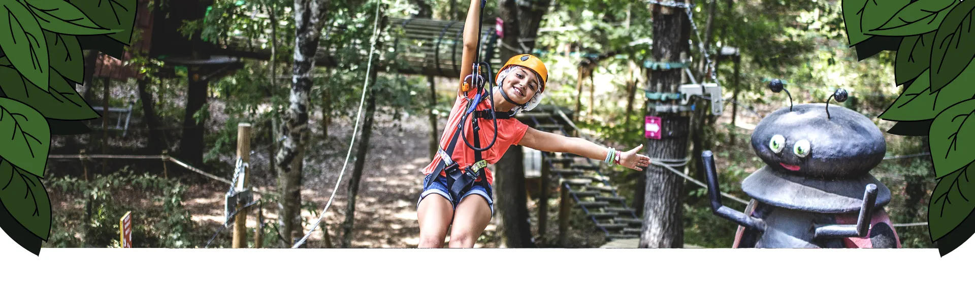 Young girl on a zip line with her arms outstretched